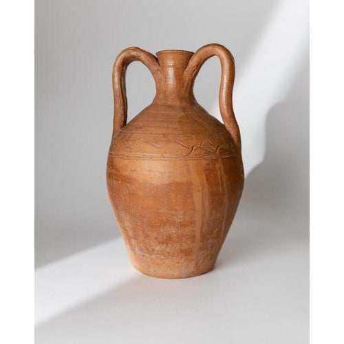 This vintage early 19th century terracotta amphora vase is a beautifully handcrafted Italian jug with a classic rural...