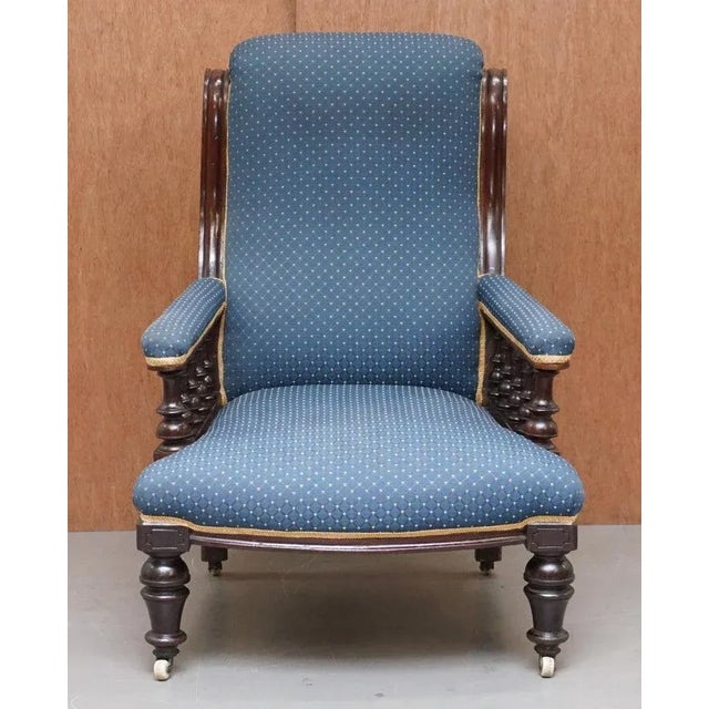 This lovely early Victorian mahogany carved library reading armchair which is part of a suite This chair is very well...