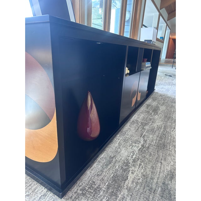A rare find for the serious collector or design-forward home: a custom-built, monumental media console measuring an...