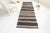 This is a vintage Turkish Oushak rug from the Mid 20th Century. The piece was hand-knotted.