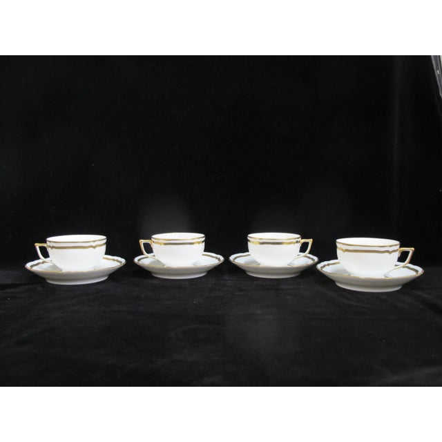 Elegant set of A Raynaud, Limoges France footed cups and saucers in Marie Antoinette pattern. Includes a set of 4 (4 cups,...