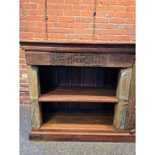 This stunning, one of a kind sideboard is handcrafted from solid reclaimed wood, blending rustic charm with intricate...