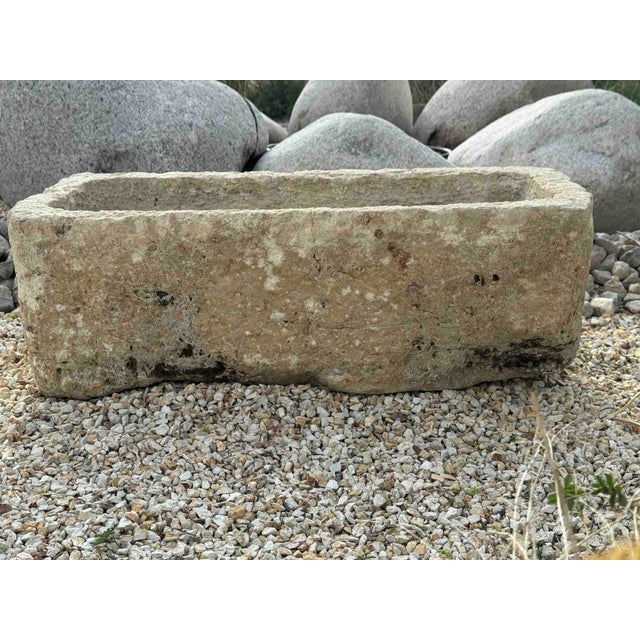 Antique French limestone vessel, has a drain hole, could be used as a fountain or a sink. Some moss, patina and wear...