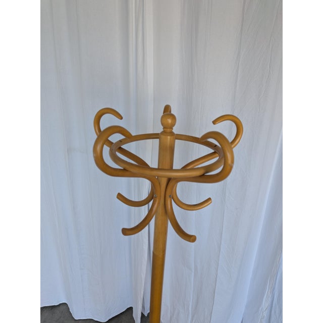 Vintage bentwood coat rack made in the Thonet style in former Yugoslavia during the 1970s. Crafted from steam-bent wood...