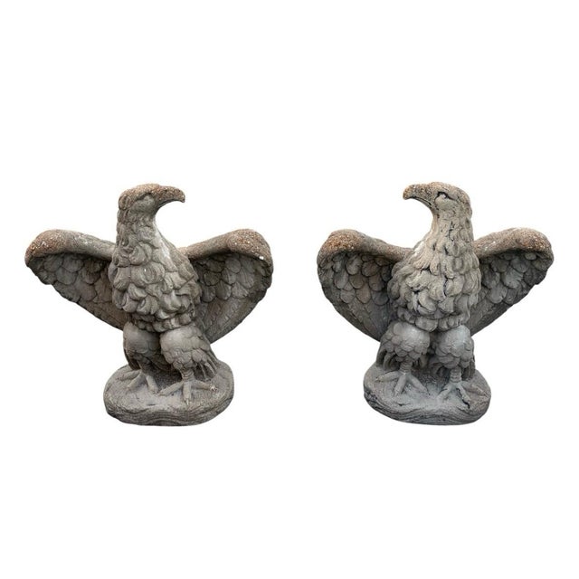 This striking pair of vintage mid-century monumental eagle statues is crafted from heavy, durable cast stone, offering an...