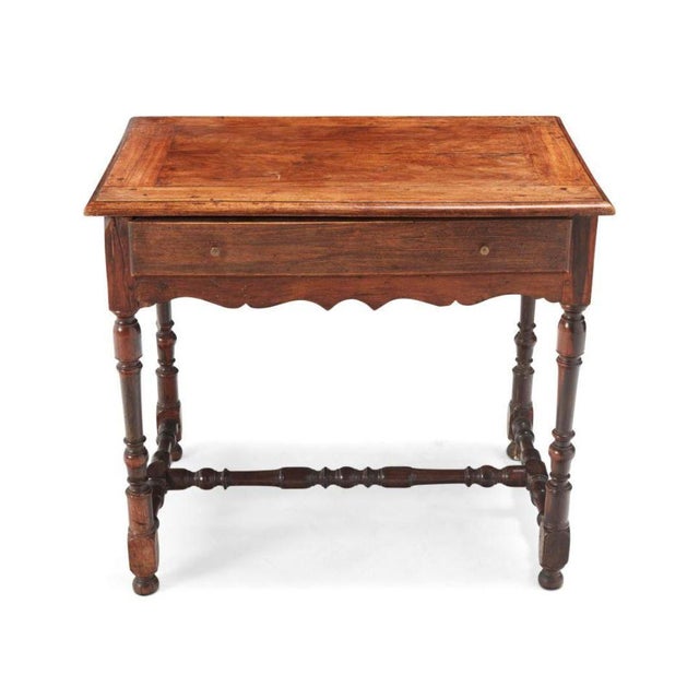 This charming low table combines traditional craftsmanship with elegant design details. Featuring a single drawer with...