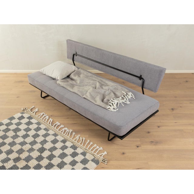 Minimalist sofa by Rolf Grunow for Walter Knoll from the 1950s. High-quality frame consisting of a wooden frame and...