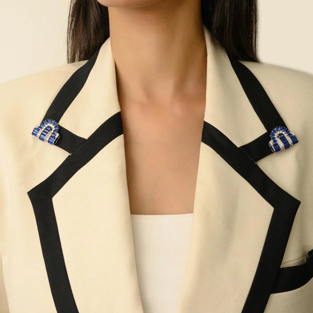 Bring sophistication and sparkle to your wardrobe with this blue cubic zircon double clip brooch pin, blending classic Art...