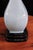A Manises-made table lamp in light blue and black glazed ceramic. Its elegant shape and balanced proportions give it a...