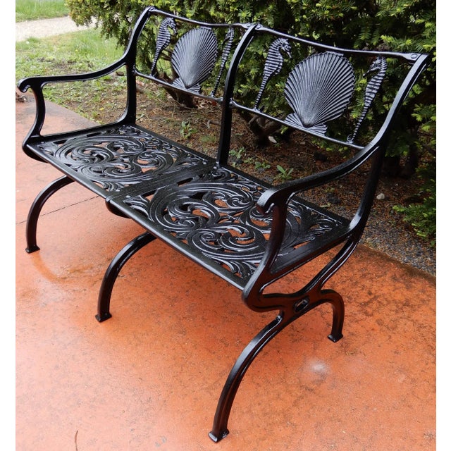 A cast aluminium garden bench by Molla in the shell and seahorse pattern. Molla is famous for making the shell and...