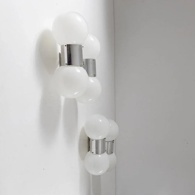 Pair of wall lamps with 4 lights each with metal frame and white glass diffusers. Stilux Milano production of the 1960s....
