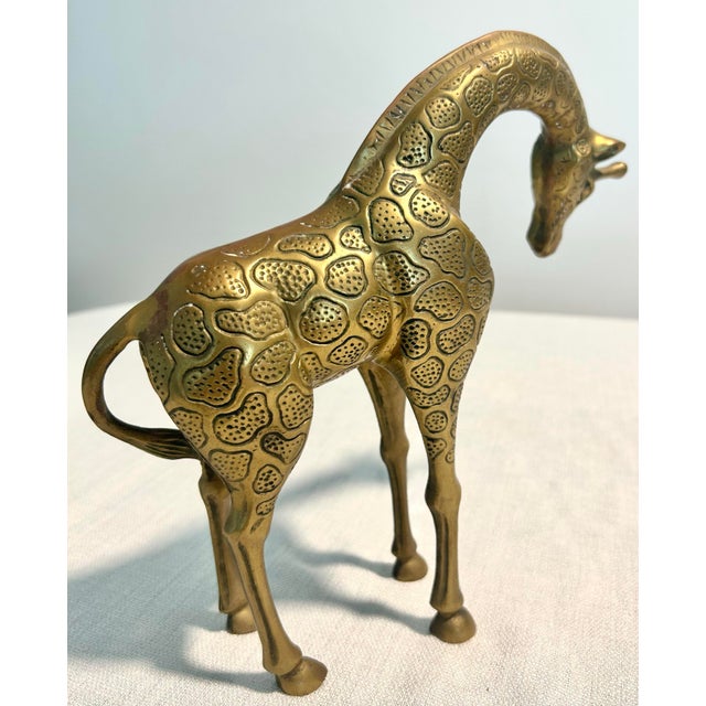 A sophisticated accent for bookshelves, consoles, bar carts, or curated vignette displays, the solid brass construction...