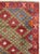 This mid-20th-century Turkish Anatolian throw rug presents a lively allover lattice of diamond-shaped compartments across...