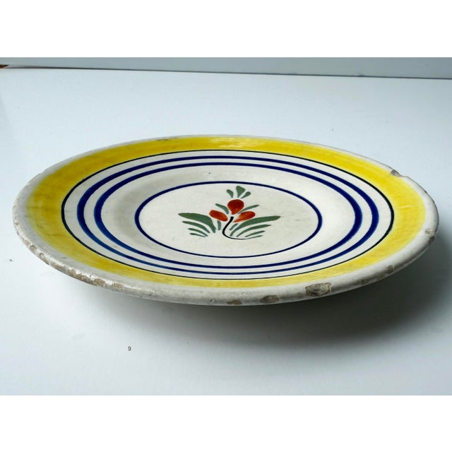 Antique plate with hand painted flower. Marked "Henriot Quimper France 723 BK"