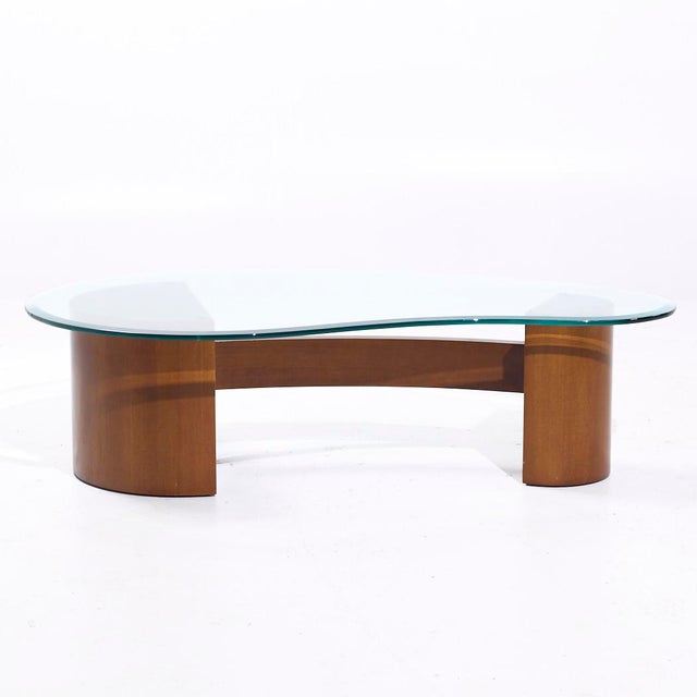 Vladimir Kagan Style Mid Century Walnut and Glass Biomorphic Coffee Table This coffee table measures: 51.5 wide x 31 deep...