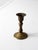 This vintage brass candlestick holder features a turned pedestal shape with a flared rim and traditional silhouette. The...