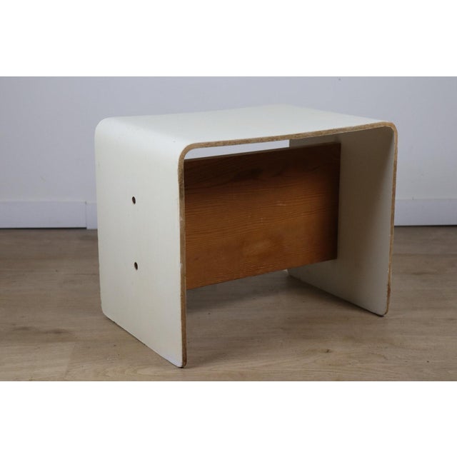 An elegant bedside table designed by Pierre Guariche, a major figure in French design of the 1950s and 60s. This piece...