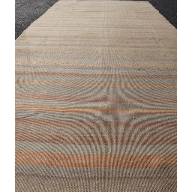 Measures: 4'8 x 13'8 Vintage Turkish Kilim Gallery Runner with Soft Stripes in Sage, Peach, and Sand. Keivan Woven Arts /...
