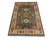 A deep gray field showcases a central star medallion surrounded by smaller Kazak motifs in burgundy, gold, blue, cream,...