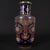 Elegant Chinese rouleau style porcelain vase with a rich deep navy blue base, decorated in vibrant famille rose enamel and...