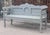 This shapely bench has a boldly scalloped top rail, rising in the center and flowing down to meet the top of the arm. The...