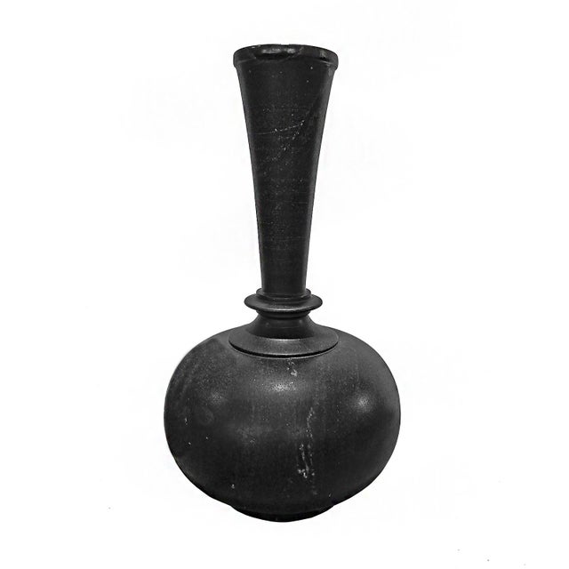 A black marble vase, hand-carved in India, circa 1950. 18 inches tall, 7.5 inches diameter. Fluted neck. Very smooth...
