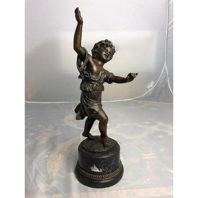 A 20th century dancing child bronze. A playful bronze figure of a little girl that can dance with the greatest of ease. An...