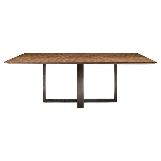 Modern Walnut and Bronze Dining table designed by Greg Sheres. This clean design combines a handsome walnut wood tabletop...