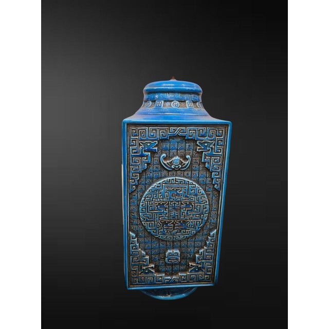 In the Chinese archaistic taste, late 19th/early 20th century An imposing square-sectioned vase and domed cover of...