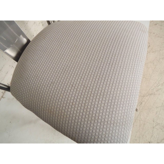 Three bar stools by Shaver-Howard with brush metal frame. Thick cushioned seats and footrests.