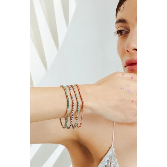 This is part of Chairish’s Fine Jewelry assortment. This 2.1 Carat Dainty Emerald May Birthstone Sleek Tennis Bracelet in...