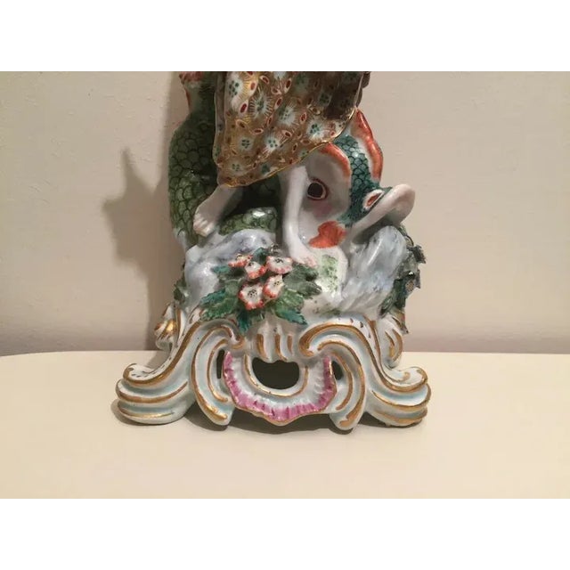 Large antique 18th century Bow porcelain figure of Neptune standing along side a dolphin on a rococo base circa 1760....