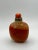 This is an interesting bottle - a glass bottle made specially to resemble banded agate. It is tall and square in shape...