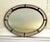 Hollywood Regency Oval Wall Mirror With Brass Accents For Sale - Image 4 of 12