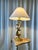 Large zoomorphic lamp, dolphin model, in bronze and gilt brass with a circular base. Produced in the 1950s-1960s in the...
