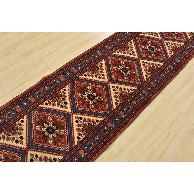 An authentic vintage traditional Roodbar rug hand-knotted with fine wool and natural dyes. This oriental rug features a...