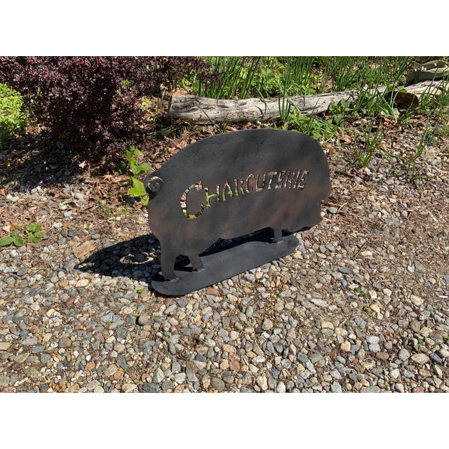 Cast Iron Sculpture of a Charcuterie Pig. Textured Cast Iron on a Welded Platform. Letters cut and filed to form the word...