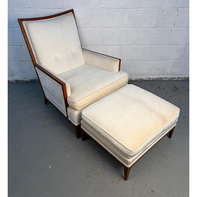 A classic Mid-Century upholstered lounge chair with matching ottoman, offering both comfort and timeless style. This set...