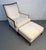 A classic Mid-Century upholstered lounge chair with matching ottoman, offering both comfort and timeless style. This set...