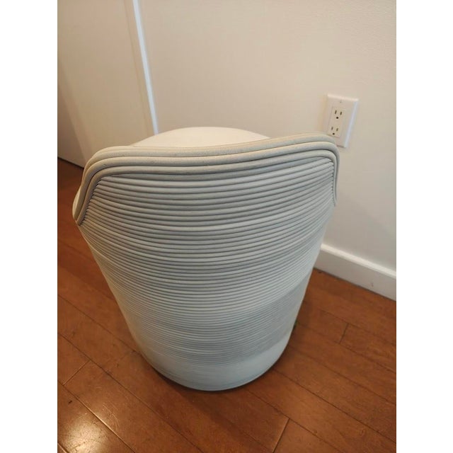 Synthetic pencil pole rattan in a weathered grey finish wrapped in a coil weave design over an aluminum pipe frame...