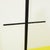 Black metal floor coat rack with a tripod structure.