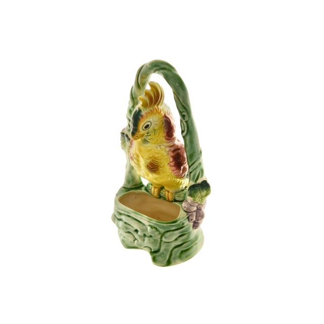 Tall hand-painted ceramic parrot or cockatoo planter in yellow, green, raspberry, purple, lavender and teal. No maker's...