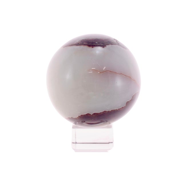 Large natural three inch agate quartz crystal ball carved and polished to highlight the tones of brown, white and burnt...