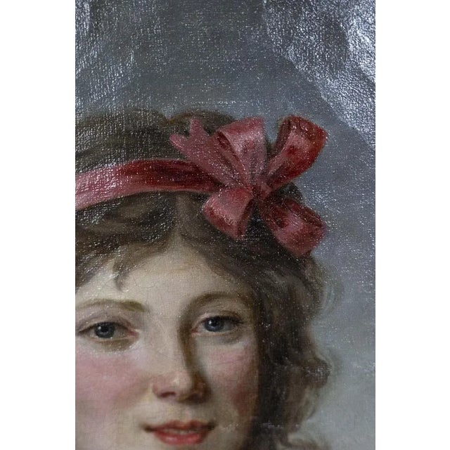 Directoire period portrait of a young woman, oval in shape, wearing a ribbon and depicted outdoors. French work realized...