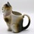 A delightful early 20th-century antique figural porcelain cat creamer jug crafted by the esteemed German pottery firm...