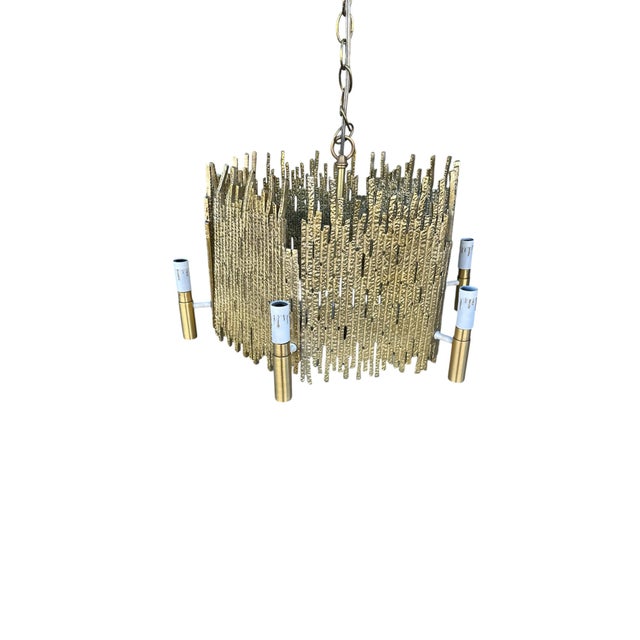 This is a brutalist brass chandelier, by Moe Light. It is in perfect condition. Two are available. The price shown is for...
