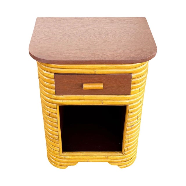 This beautifully restored pair of streamlined Art Deco stacked rattan bedside tables each with a mahogany top blending...