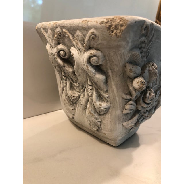 This beautiful — and unique — Concrete Planter With Floral Design (rise buds and leaves) will look amazing in your garden,...