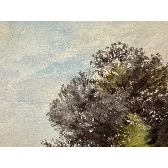 Original watercolor on paper depicting a pastoral marsh or riverside landscape with two small figures seated beneath a...