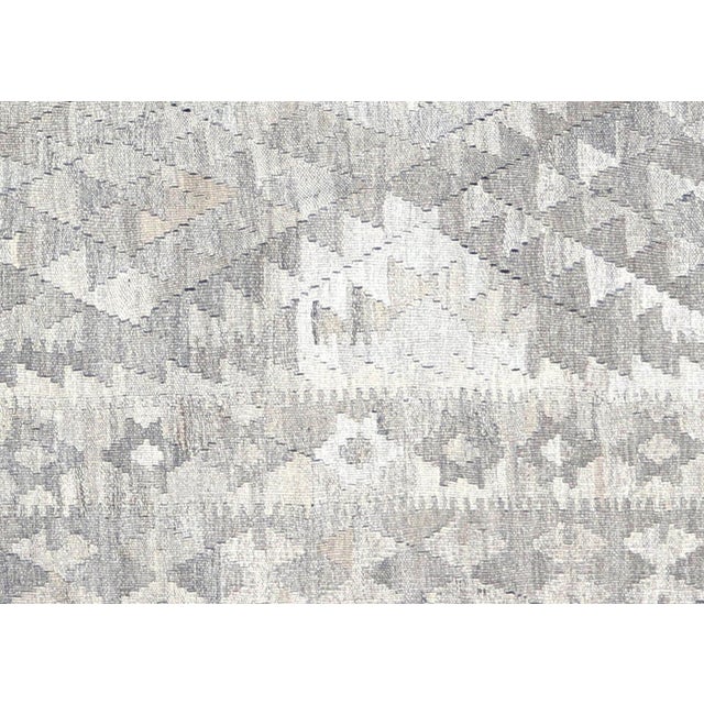 Authentic hand-woven kilim from the Maimana tribes of Northern Afghanistan, crafted with wool on wool foundation. This...